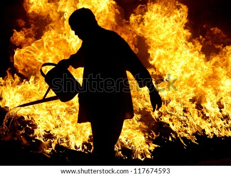 AMPANG, MALAYSIA - OCT. 31: Devotee preparing the charcoal fire for the fire-walk at Lam Thian Kiong Temple on October 31, 2007. Taoist devotees walks on the burning charcoal to fulfill their vows.
