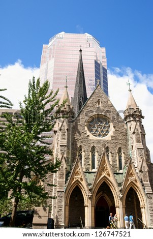 MONTREAL, CANADA - AUGUST 18: Christ Church Cathedral on August 18, 2008 in Montreal, Canada. Formerly the first Anglican Cathedral of Montreal. In the background the KPMG Tower.