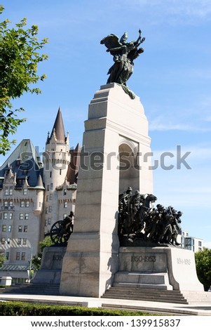 OTTAWA, CANADA - AUGUST 8: National War Memorial on August 8, 2008 in Ottawa, Canada. The monument is composed of 23 bronze figures and a stone arch. In the background the Chateau Laurier Hotel.