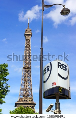 PARIS, FRANCE - AUGUST 17: the Eiffel Tower (Tour Eiffel) and RER sign on August 17, 2013 in Paris, France. RER represents the metropolitan underground tramsportation of Paris.