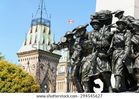 OTTAWA, CANADA - AUGUST 8: National War Memorial designed by Vernon March and unveiled by King George VI in 1939 and the Canadian Parliament building in downtown on August 8, 2008 in Ottawa, Canada.