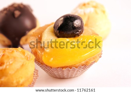 Close-up of some assorted delicious tea cakes isolated on white