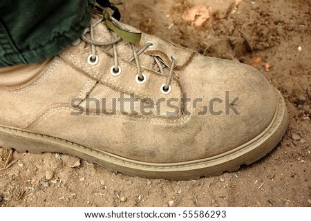 Soldier\'s foot in desert - US Army boot