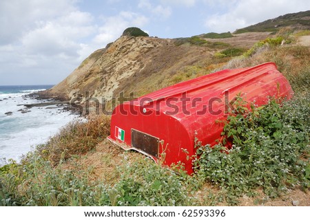 Red boat on cliff - italy - sardinia