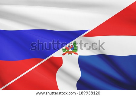 Flags of Russia and Dominican Republic blowing in the wind. Part of a series.