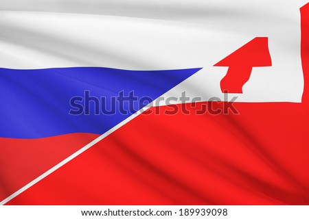 Flags of Russia and Kingdom of Tonga blowing in the wind. Part of a series.