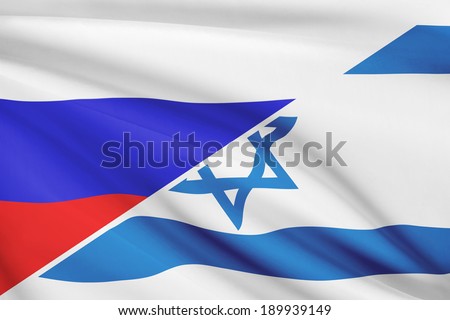 Flags of Russia and State of Israel blowing in the wind. Part of a series.