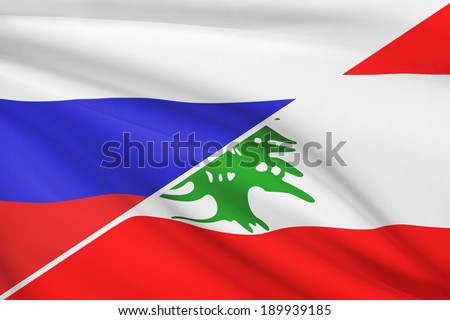 Flags of Russia and Republic of Lebanon blowing in the wind. Part of a series.