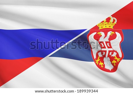 Flags of Russia and Republic of Serbia blowing in the wind. Part of a series.
