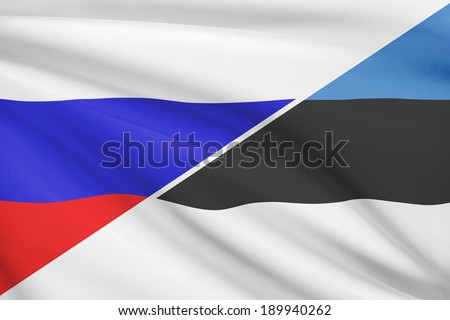 Flags of Russia and Republic of Estonia blowing in the wind. Part of a series.