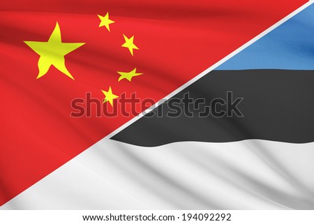 Flags of China and Republic of Estonia blowing in the wind. Part of a series.