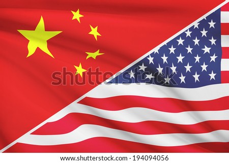 Flags of China and United States of America blowing in the wind. Part of a series.