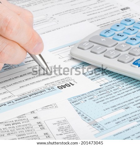 Tax Form 1040 - man filling out tax form - 1 to 1 ratio