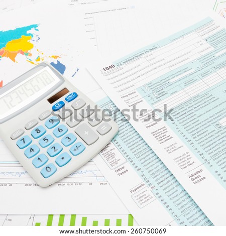 US 1040 Tax Form and calculator - studio shot