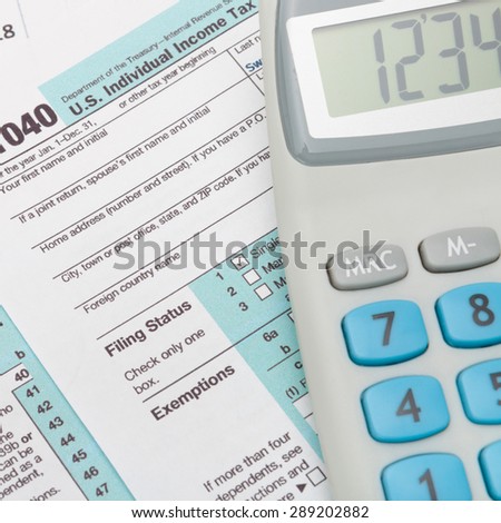 US 1040 Tax Form and calculator - close up shot