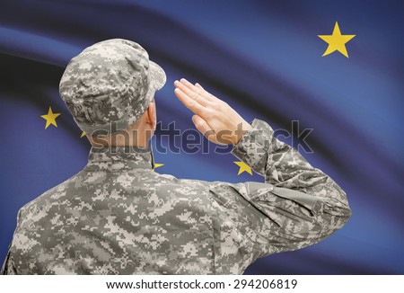 Soldier saluting to USA state flag conceptual series - Alaska