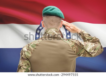 Soldier saluting to US state flag series - Missouri