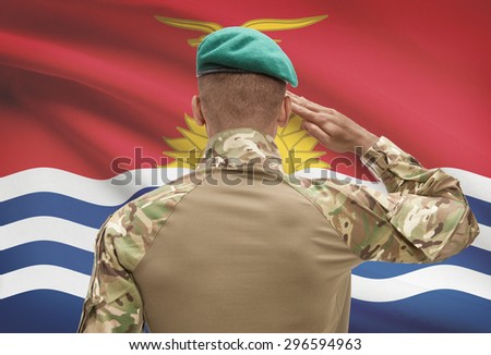 Dark-skinned soldier in hat facing national flag series - Kiribati