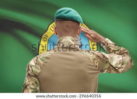 Dark-skinned soldier in hat facing US state flag series - Washington