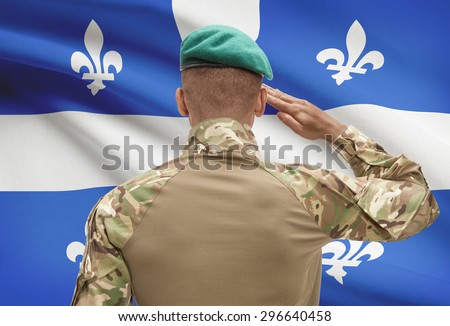 Dark-skinned soldier in hat facing Canadian province flag series - Quebec