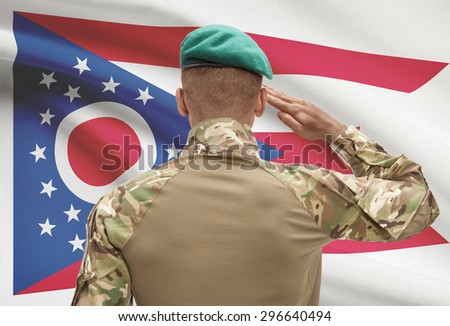 Dark-skinned soldier in hat facing US state flag series - Ohio