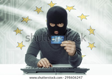 Dark-skinned hacker with credit card and USA states flag on background - Rhode Island