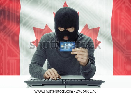 Dark-skinned hacker with credit card and flag on background - Canada