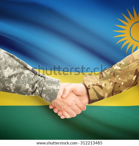 Soldiers shaking hands with flag on background - Rwanda