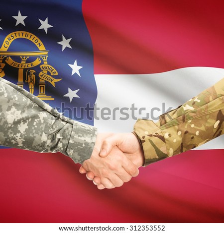 Soldiers handshake and US state flag - Georgia
