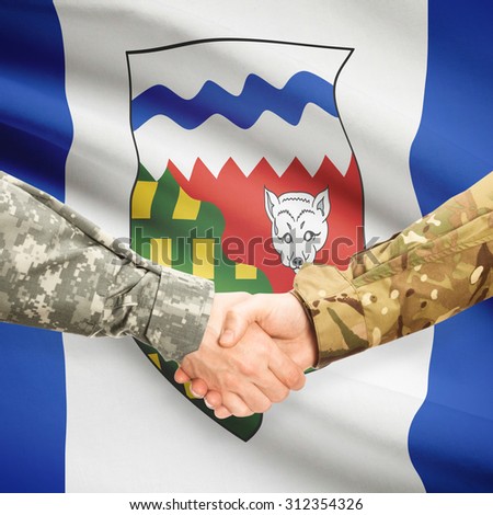 Soldiers handshake and Canadian province flag - Northwest Territories