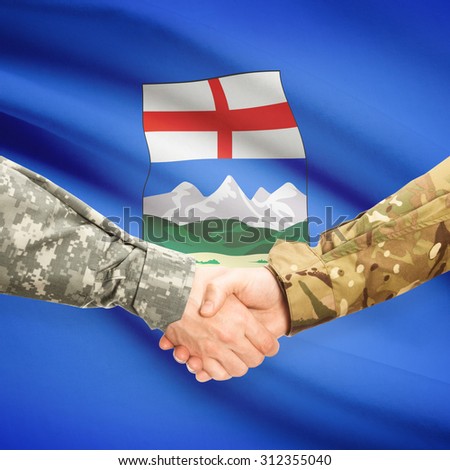 Soldiers handshake and Canadian province flag - Alberta