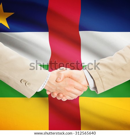 Businessmen shaking hands with flag on background - Central African Republic