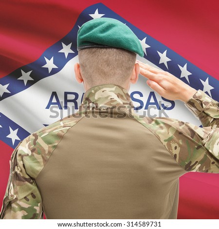 Soldier saluting to US state flag series - Arkansas
