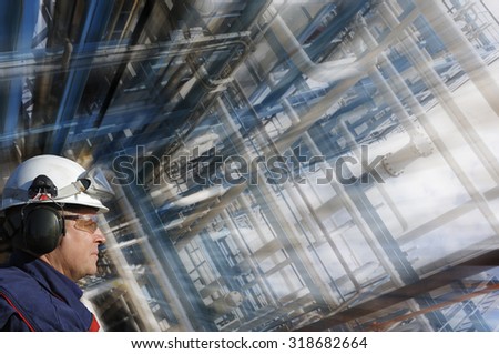 oil and gas worker with giant pipelines construction, slight zoom effect on background