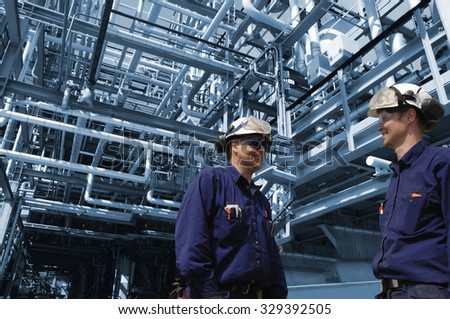 oil and gas workers inside refinery industry, pipelines constructions