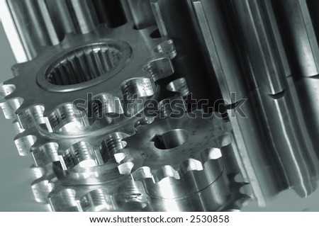 gear, pinion-machinery in a greenish metallic cast
