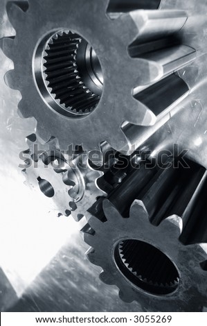 three gears-assembly against steel and highlights all in a metallic duplex blue