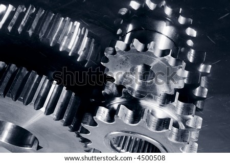 gear parts mirrored in steel, all in a dark satin duplex toning