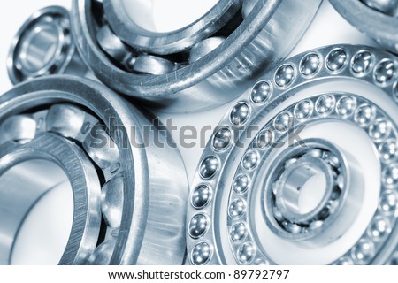 ball bearing gears and pinions, set against a light-blue background and ideal for isolations, cut-outs.