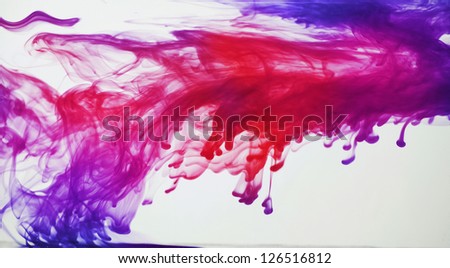 Blue, purple, pink and red ink in water