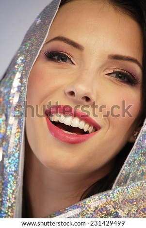 Woman wearing a silver sequin hoodie