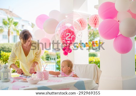 Mother Cut Cake on Outdoor Birthday Party for a Little Cute Girl