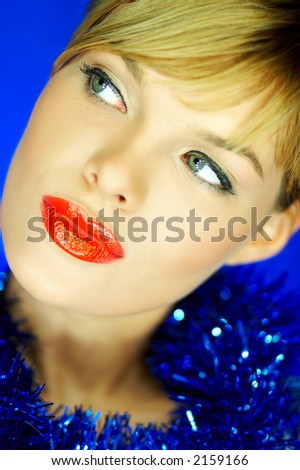 Portrait of Beautiful woman with red lipstick and color chain on her neck