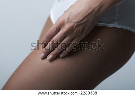 Beautiful womans body part wearing white underwear on clear background
