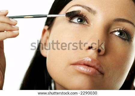Portrait of Beautiful brunette woman doing daily morning routines (the make up series)