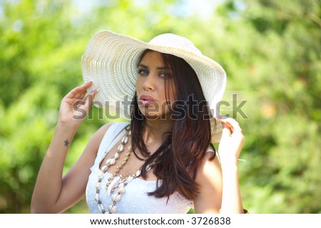 20-25 years old beautiful woman wearing hat, at outdoor