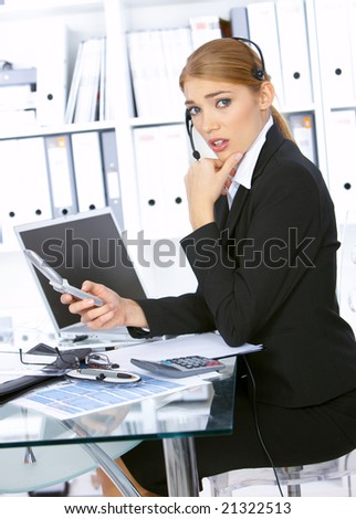 Disgusted Business woman working in office, wearing headset