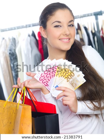 Portrait of a young lady with bags and bunch of money