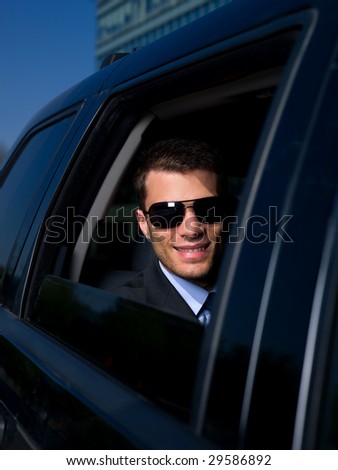 Portrait of business man inside the car