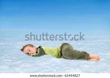 Sleeping boy in the clouds, dreaming about something nice.